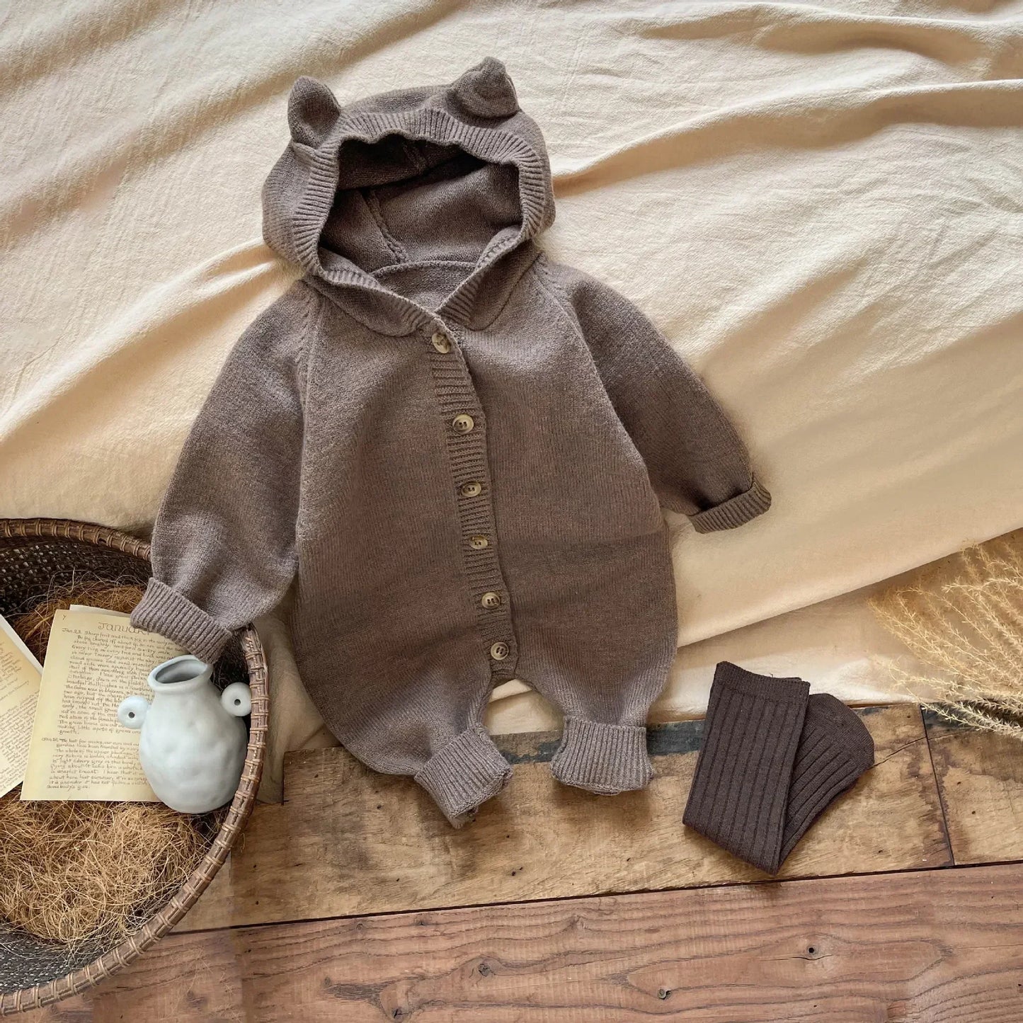 Bambino's Knitted Button Onesie