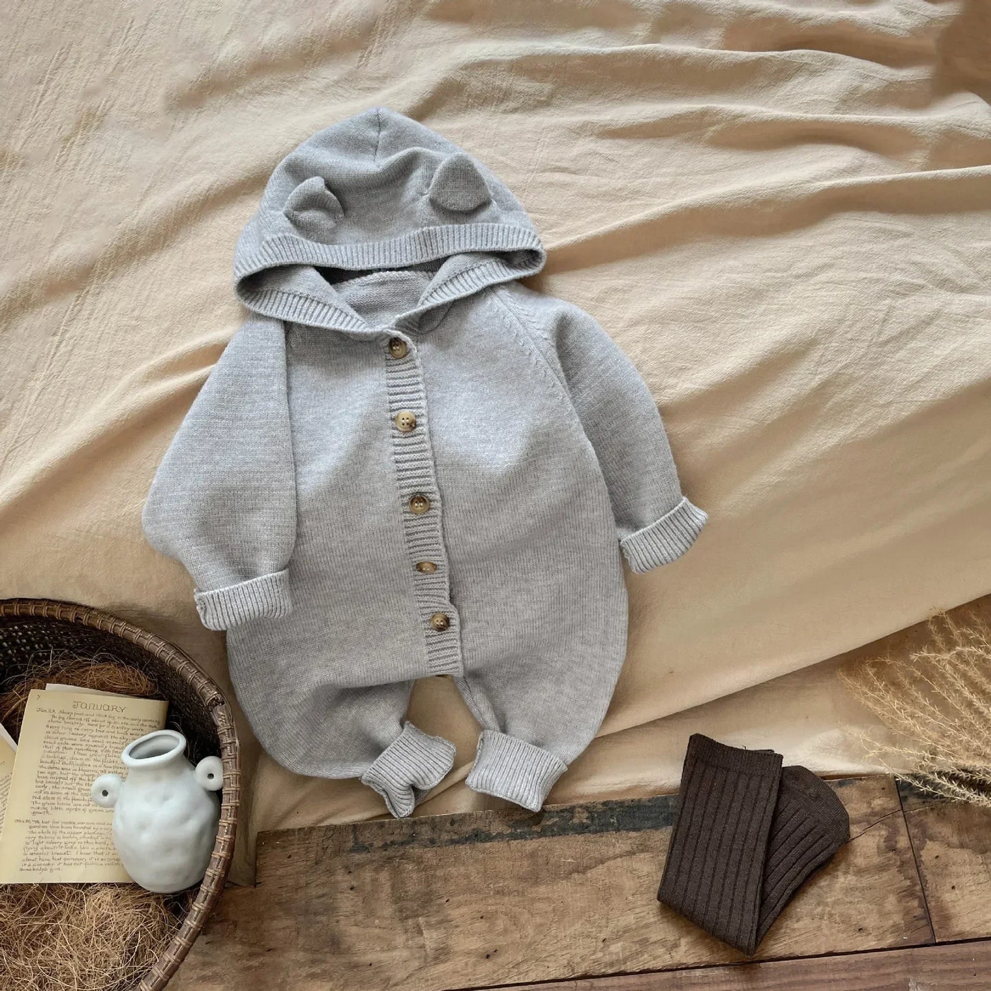 Bambino's Knitted Button Onesie